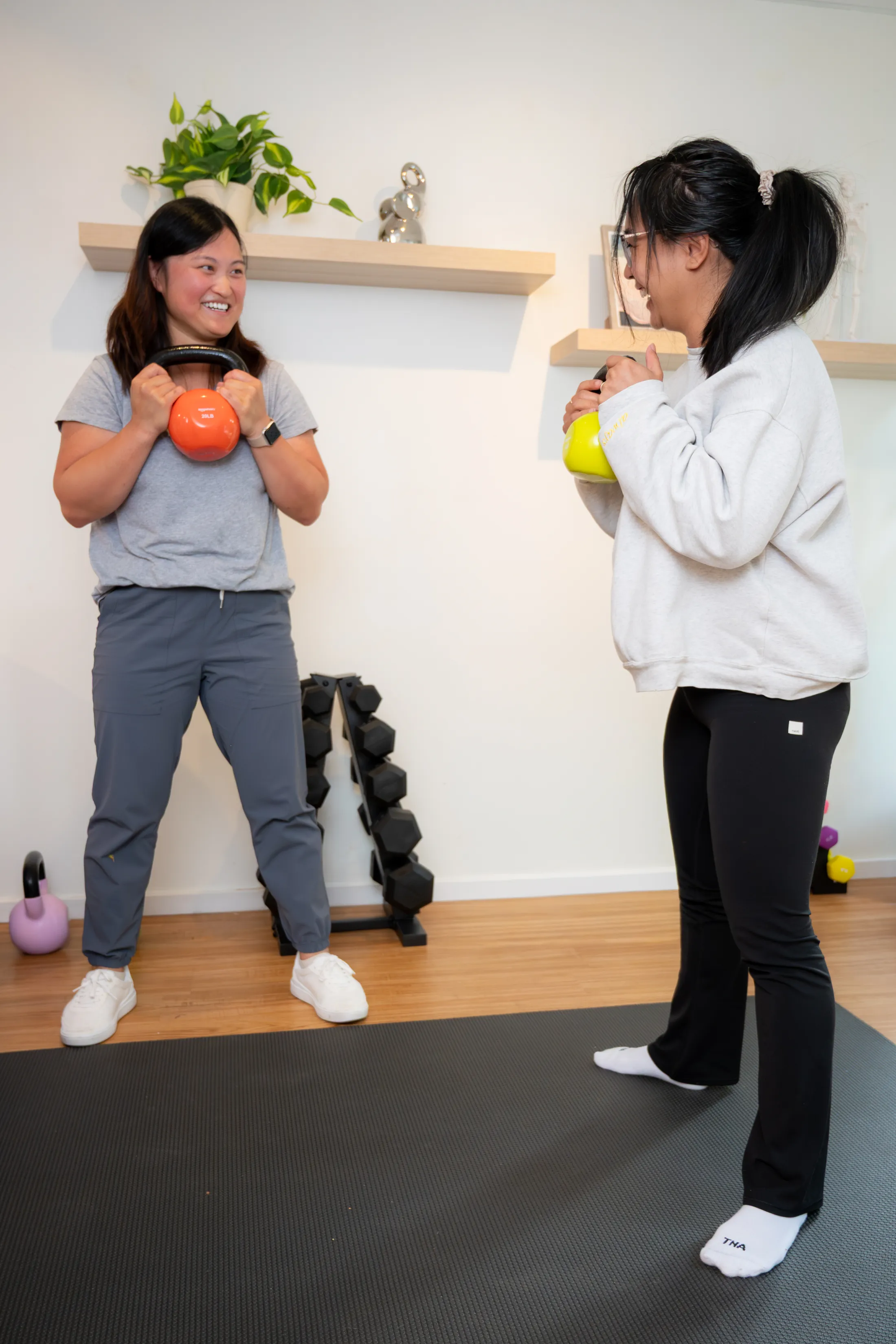 Dr. Meilin coaching a patient through kettlebell strength training